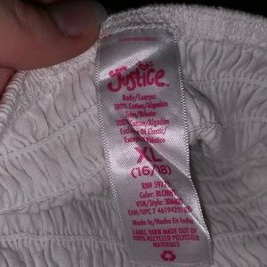 White frilly sleeveless blouse